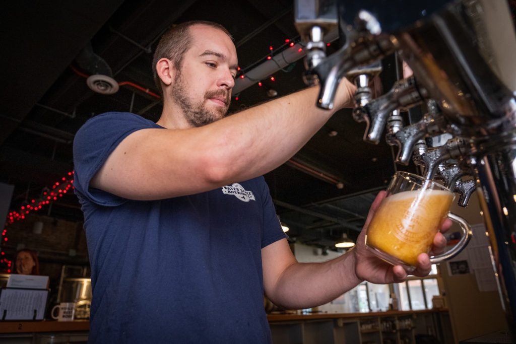 Man pouring craft beer