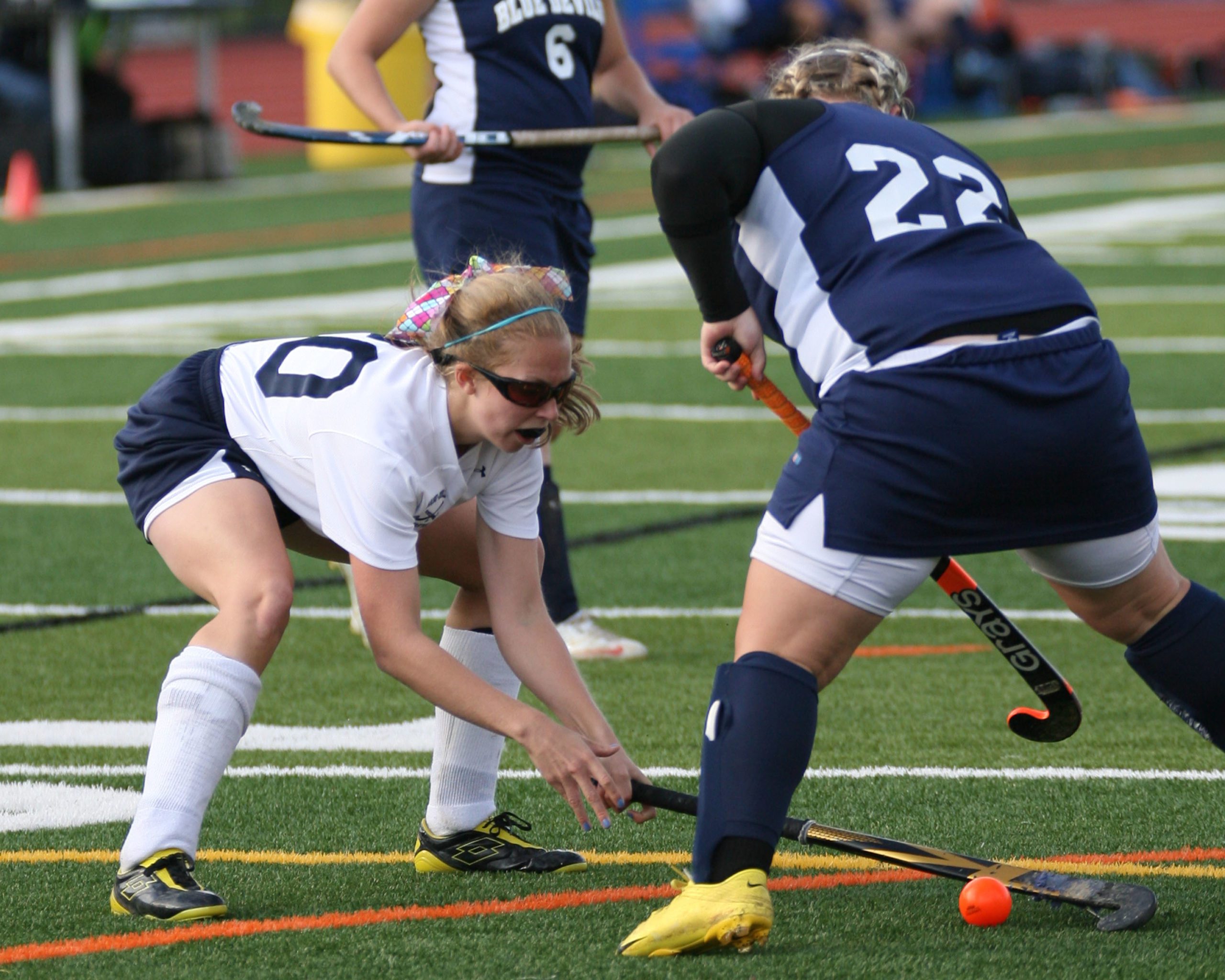 Woman's field hockey game in action