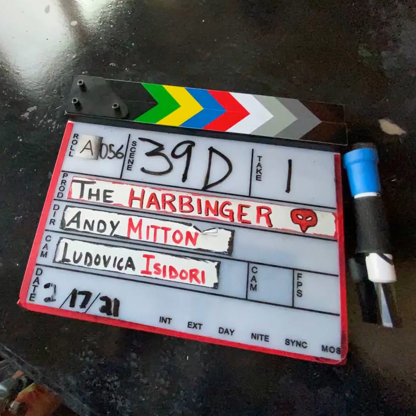 A clapperboard for the film "The Harbinger."